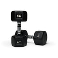 Various black hex dumbbells standing upright showing different weight options for progressive strength training.