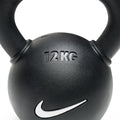 Close-up of 26lb rubber-coated kettlebell handle showing ergonomic grip design for comfortable training sessions.