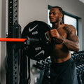 Nike Strength weight plates showing two different design options with detailed view of grip handles and weight markings.